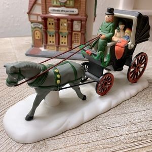 Department 56 Christmas in the City Collection. Horse drawn carriage ride.